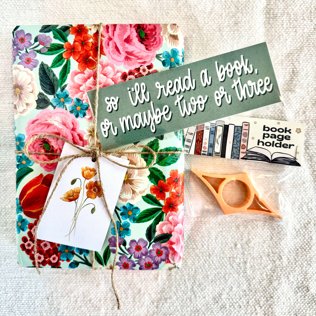 Our Blind Date and Bookmarks Gift Set is the perfect cozy surprise for the reader in your life. This thoughtfully curated set includes a “Blind Date with a Book,” a convenient page holder, and a stylish bookmark — everything needed for the ultimate reading night in.