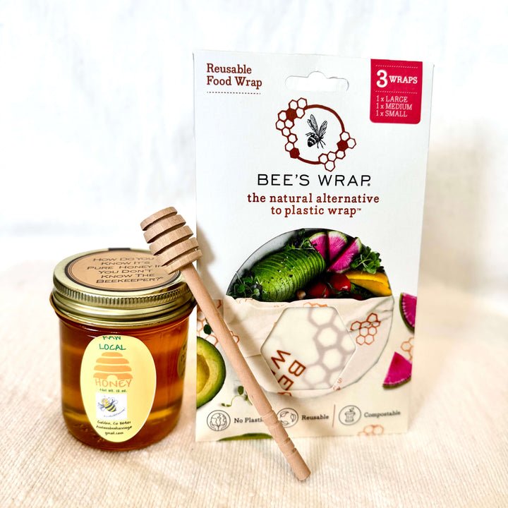 Treat someone special to a little sweetness with our Sweet as Honey Gift Set. Thoughtfully curated with locally made favorites, this cozy set includes a jar of local honey, a classic honey dipper, and a set of 3 reusable beeswax wraps—perfect for the kitchen, tea lovers, or anyone who appreciates simple everyday essentials.